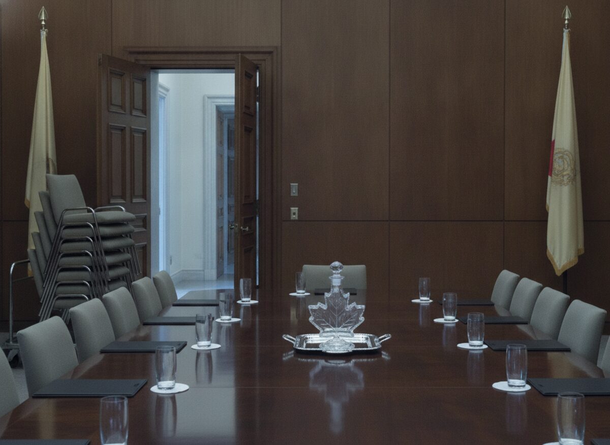 Press photo: a formal negotiating room where every chair on one side of the long table has been loaded onto a hand truck by the door, a maple-leaf decanter at the table's center